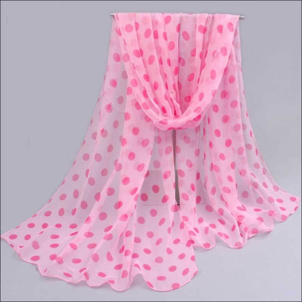 A delicate pink polka dot chiffon polka dot silk head wrap scarf with a soft flowing drape.