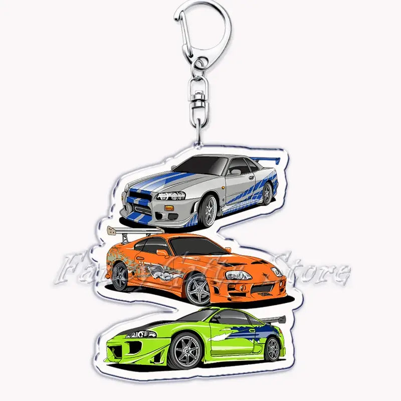 Silver and blue Nissan Skyline acrylic car keychain featuring three iconic fast and furious racing cars in a detailed design.
