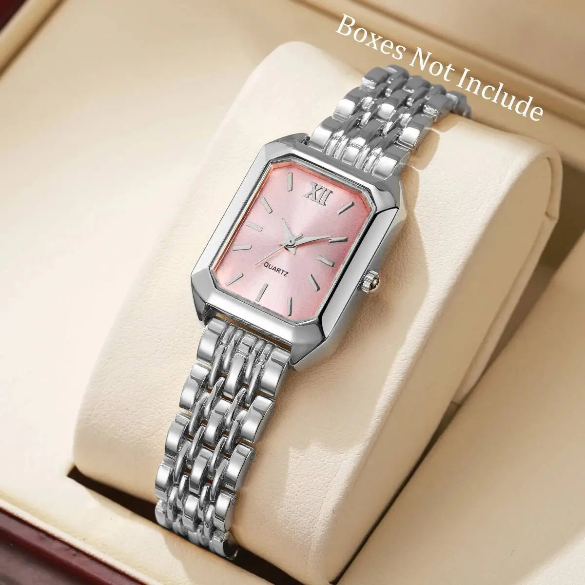 Women gold rectangle quartz watch with a sleek silver-toned case, pink mother-of-pearl dial, roman numeral hour markers, and an elegant mesh strap.