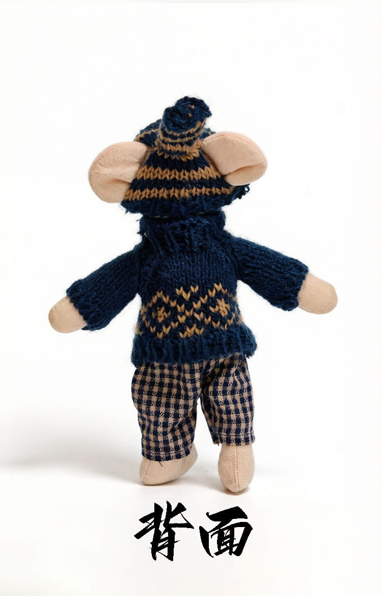 A plush mouse doll stuffed animal toy wearing a navy blue knitted sweater with tan geometric patterns, a matching knit hat, and plaid trousers.