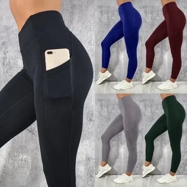 black high-waisted booty lifting leggings with a side pocket holding a white smartphone showing the front view