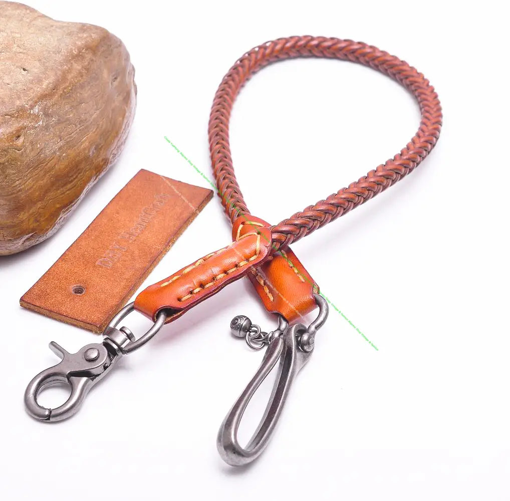 A braided orange leather biker wallet chain with a silver-toned metal clasp and carabiner for punk jeans accessory.