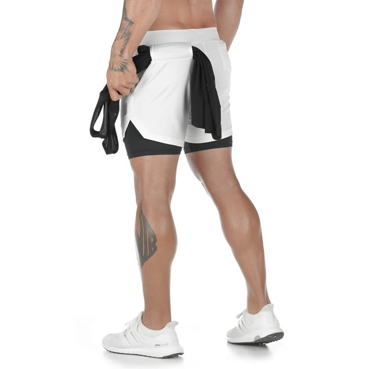 Men 2 in 1 gym shorts in white and black featuring quick dry material and a sleek modern design for workout and activewear use.