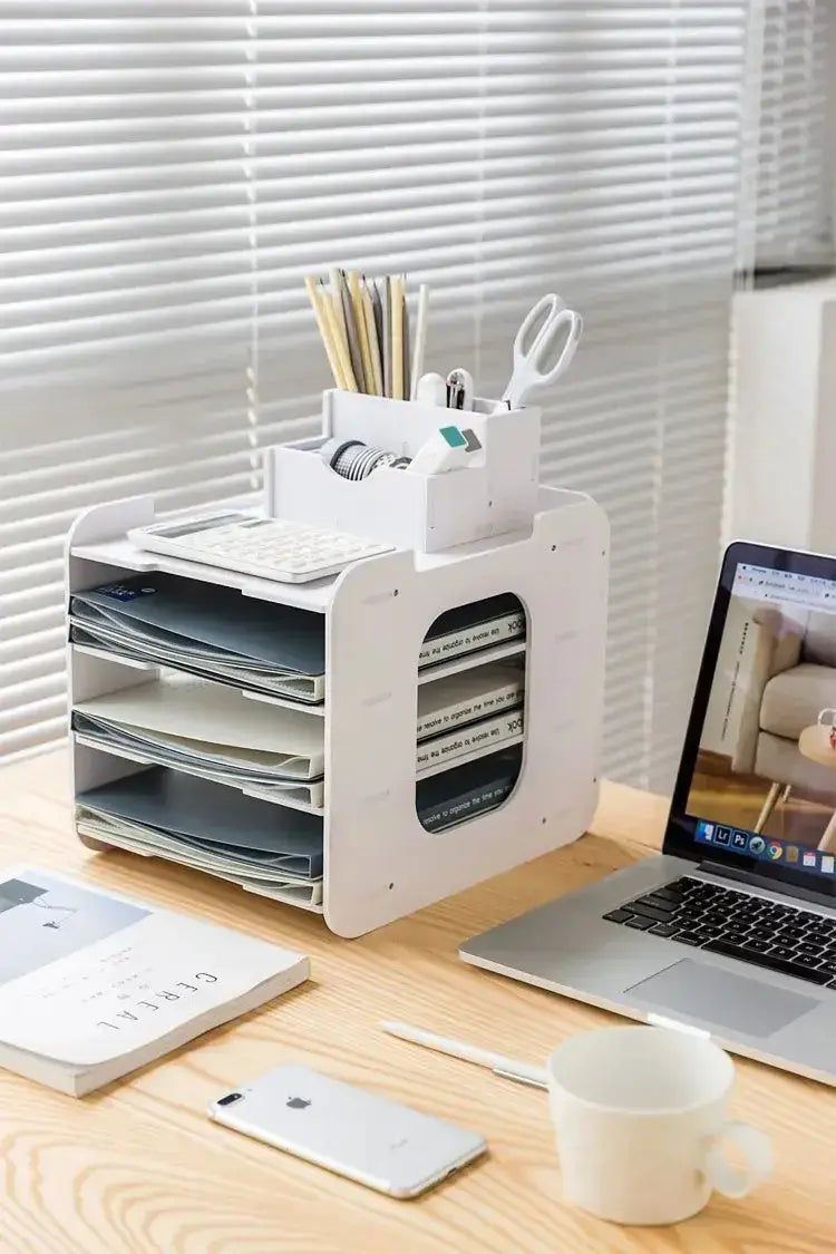 White plastic desktop file organizer and storage rack with multiple compartments holding papers keyboard tray and office supplies for efficient desk organization.