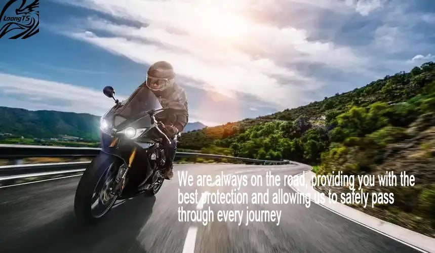Black motorcycle with sleek design and shiny chrome accents ridden by a motorcyclist in full gear on a winding road featuring a motorcycle wireless charging phone mount.