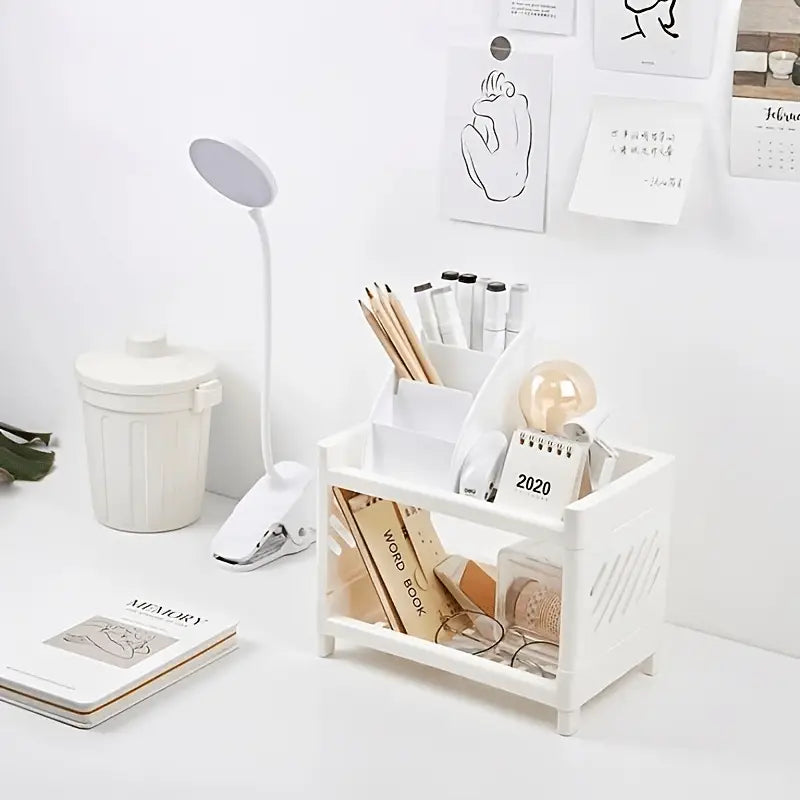 White plastic two-tier desk organizer with slanted compartments and lattice-patterned side panels for efficient storage and organization.