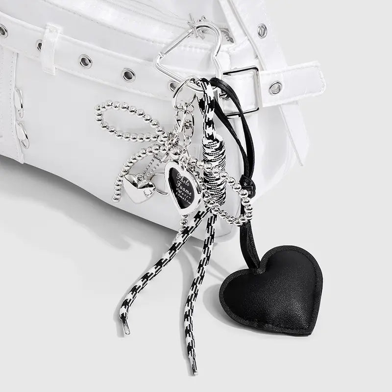 Black heart-shaped leather charm with silver-toned metal accents and a beaded chain for heart pendant bowknot bag keychain.
