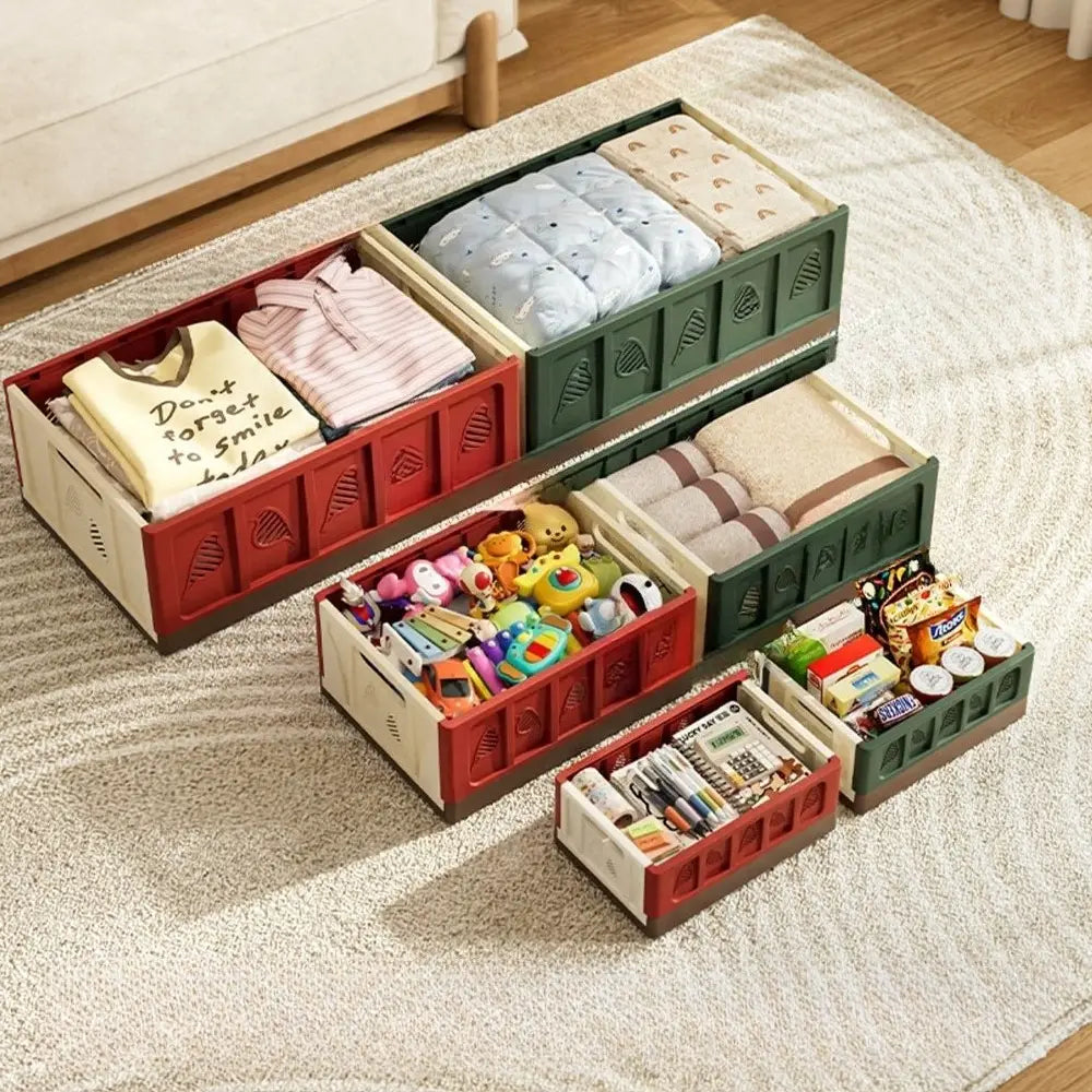 Foldable storage basket plastic stackable organizer in red and green with leaf-patterned sides made of durable plastic, containing actual goods such as clothes, toys, snacks, and stationery, without chromatic aberration.