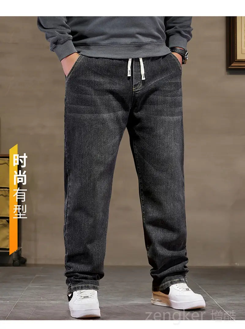plus size elastic waist loose straight jeans in dark-wash denim with white drawstrings at the waistband