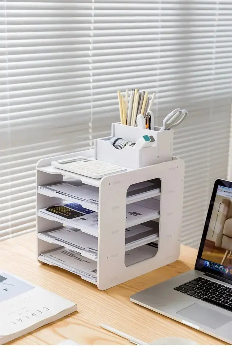 White plastic desktop file organizer and storage rack with multiple compartments holding papers calculator and office supplies.
