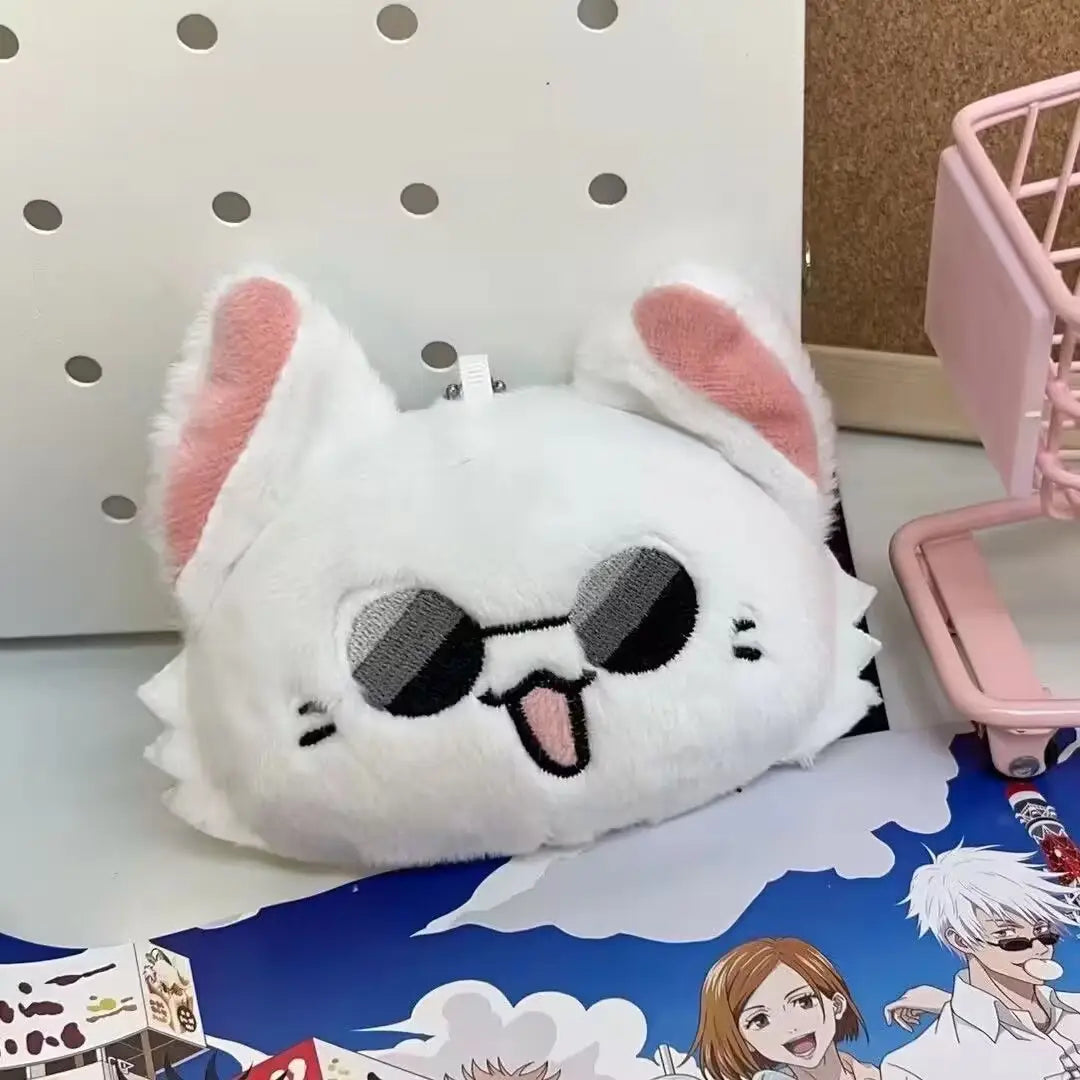 gojo and geto cat plush anime keychain featuring a white plush cat-shaped wallet with pink inner ears, embroidered sunglasses, and a tongue sticking out.