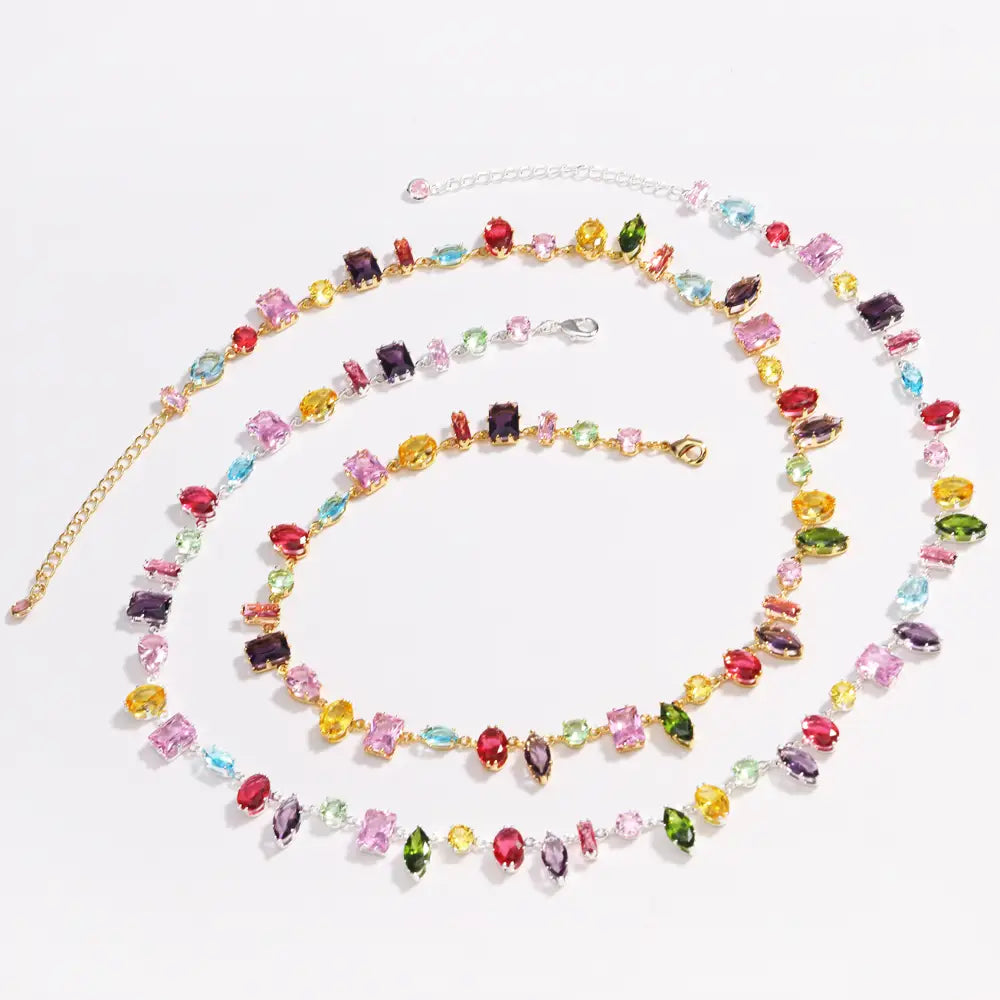 A colorful zircon crystal gold plated necklace with a vibrant multi-strand design featuring gemstone beads in various shapes and sizes on gold-toned chains.