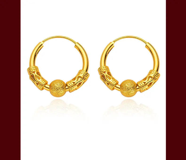 Ohrringe mit Gold-Drachenring mit kunstvollen Designs für den Drachenkopf und einer strukturierten kugelförmigen Goldperle, ideal als feines Schmuck-Geschenk.