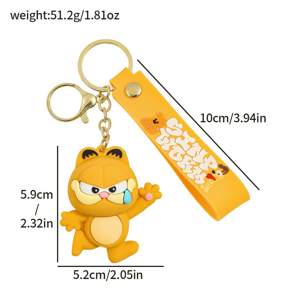Orange Garfield rubber keychain figurine with a yellow wrist strap featuring since 1970 text and cartoon characters used as an anime cat key pendant.
