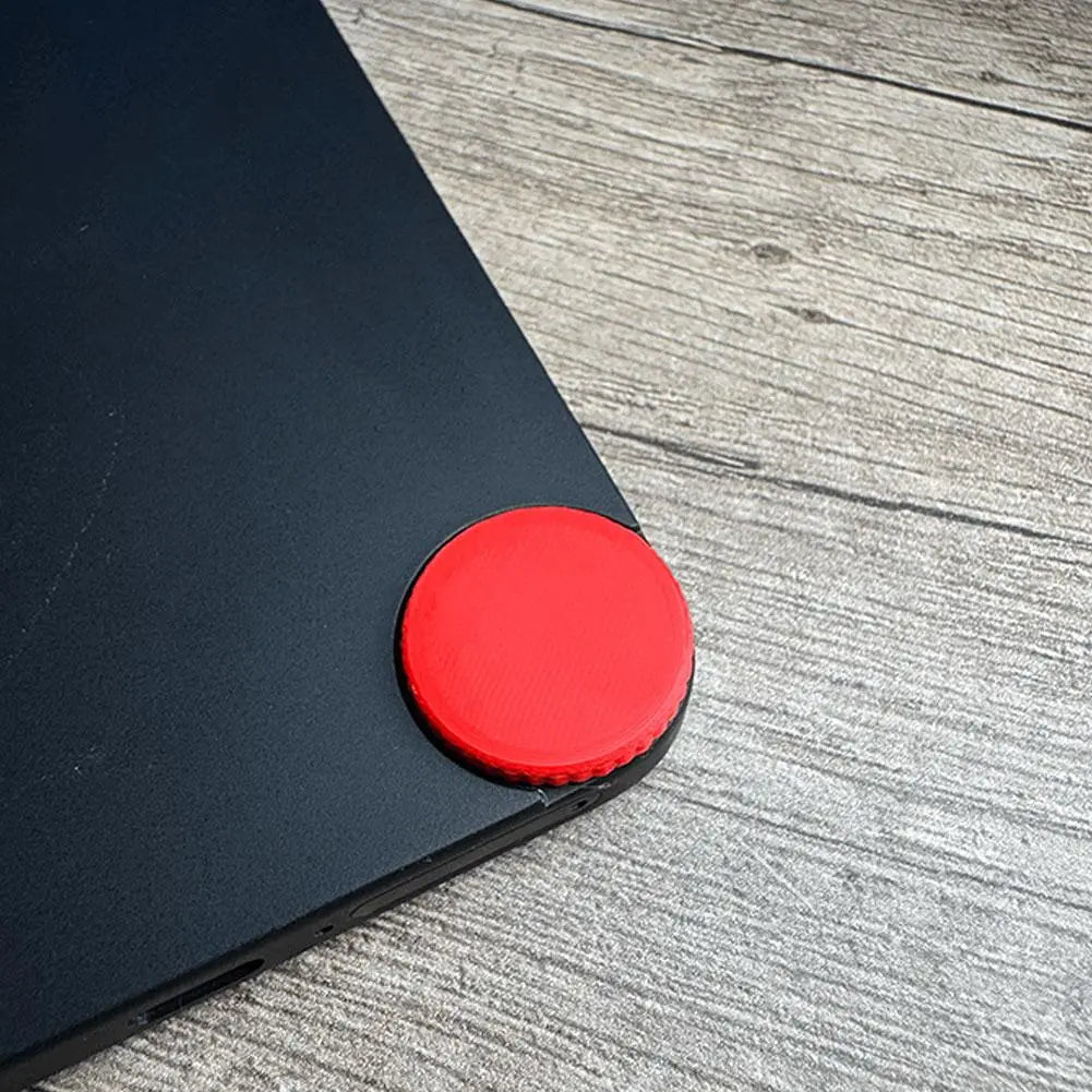 Support de téléphone circulaire rouge avec bord texturé, conçu pour une prise sûre et un positionnement stable, en remplacement du capuchon d’accent personnalisé du téléphone CMF 1