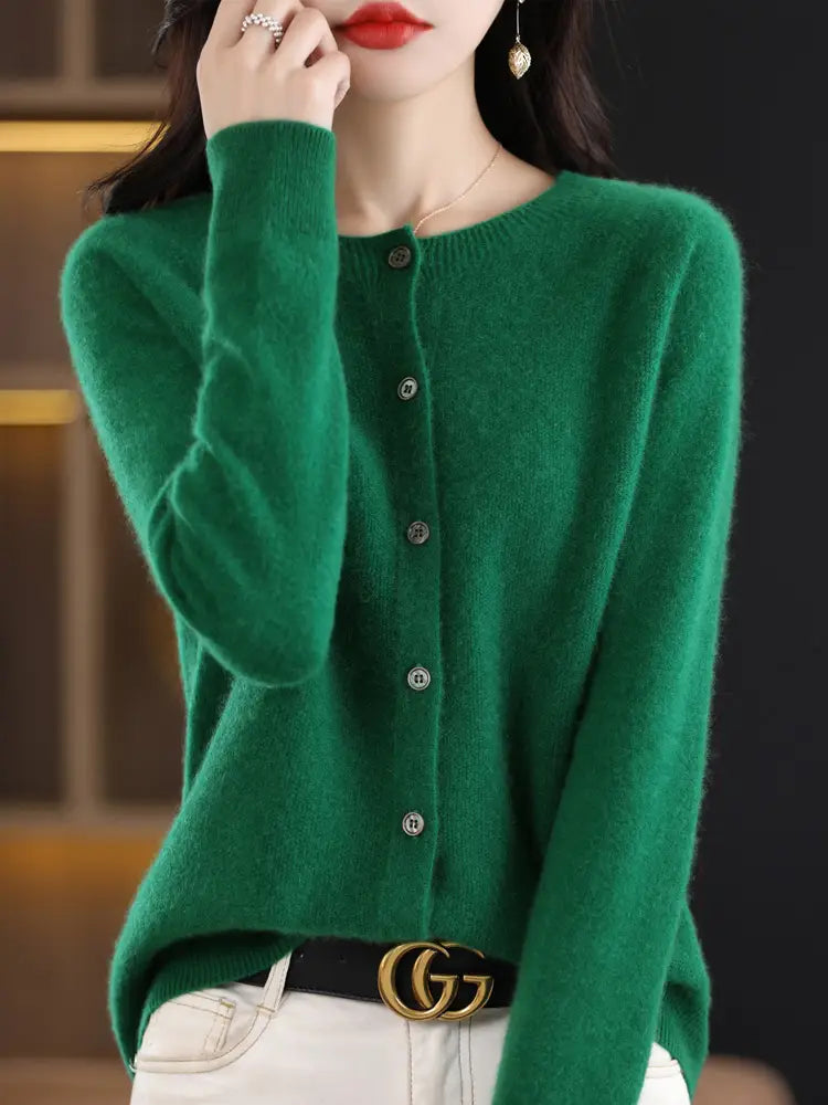Vibrant emerald green cashmere knit merino wool cardigan for women featuring silver-toned buttons and a soft textured knit.