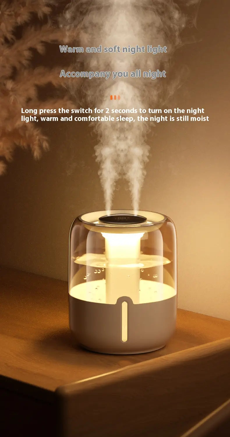 Un humidificador de aire inteligente de doble niebla de 3,8 l, elegante, con parte superior de vidrio translúcido y base gris mate, emite una niebla suave bajo una iluminación ambiental cálida.