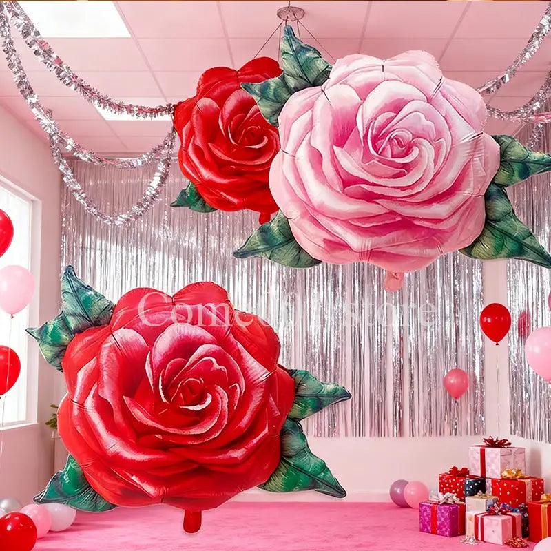 Rose foil balloons for party decorations featuring shiny foil material shaped like pink and red roses with green leaves.