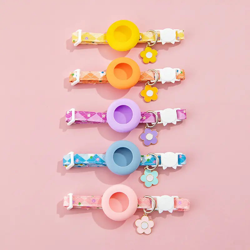 pastel-colored silicone airtag cat collars with floral-patterned fabric straps and matching flower-shaped charms featuring an airtag protective case for outdoor park dog and park dog cat safety