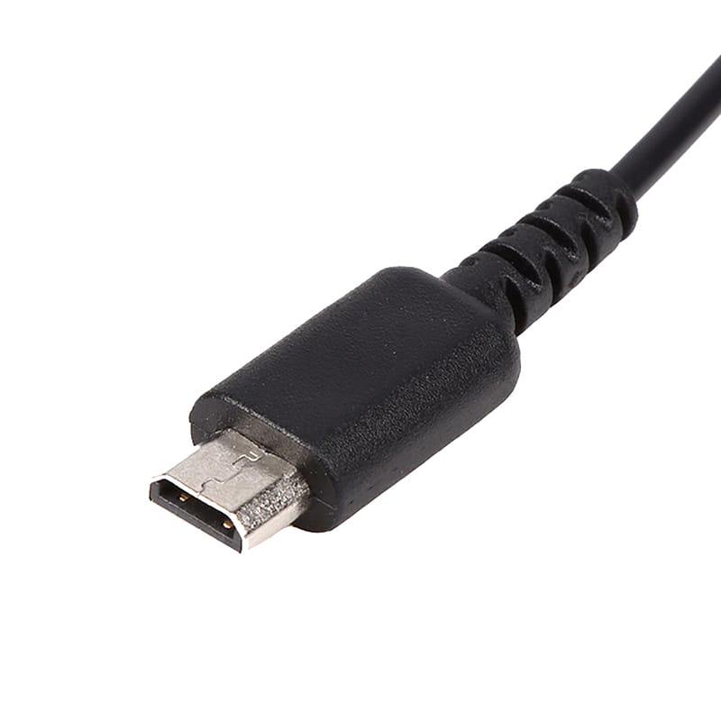 Black usb micro-b connector with metallic contact plate shown from the back side on a 5 in 1 multi console usb charging cable.