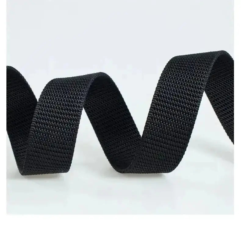 Black woven nylon webbing strap with a textured durable weave for a tactical nylon belt with matte buckle designed for men outdoor use.