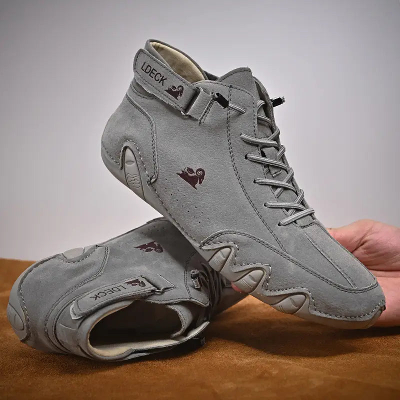Men high top leather casual sneakers in gray suede with a subtle brown logo and ankle strap featuring a sleek design from ldeck.