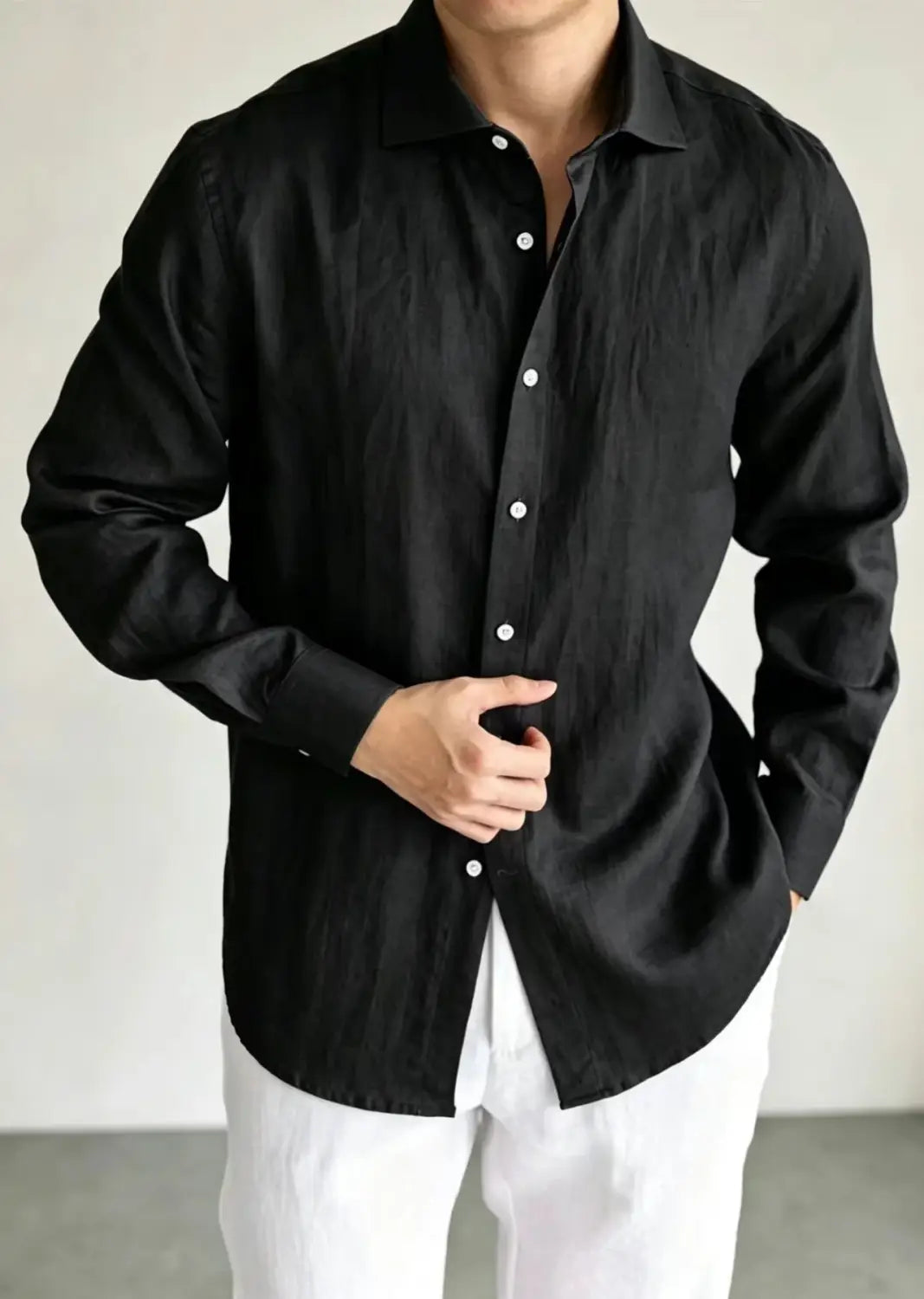men cotton linen casual button down shirt in black featuring a classic collar and white buttons.