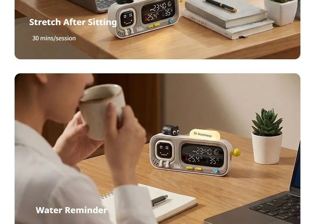 gray and white duka mooda smart temperature and humidity clock with a cute cartoon face displaying time temperature and humidity on its digital screen