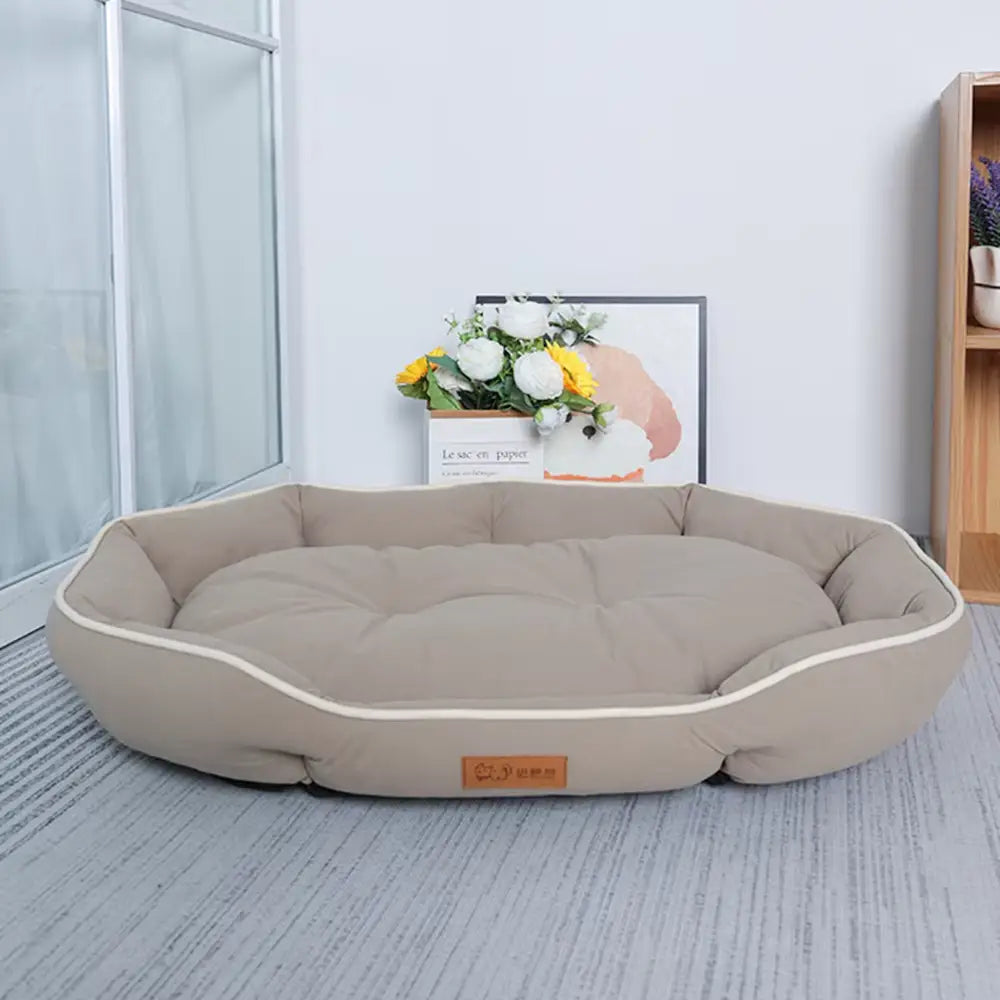 large pink plush sofa sleeping bed for dogs featuring a beige plush dog bed with cream-colored piping and a soft cushioned interior