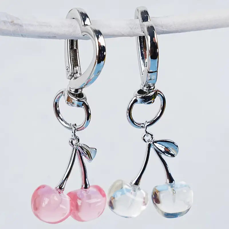 Silver-toned hoop earrings with dangling cherry charms featuring pink and clear faceted glass beads, part of the cherry bag charm heart keychain collection.