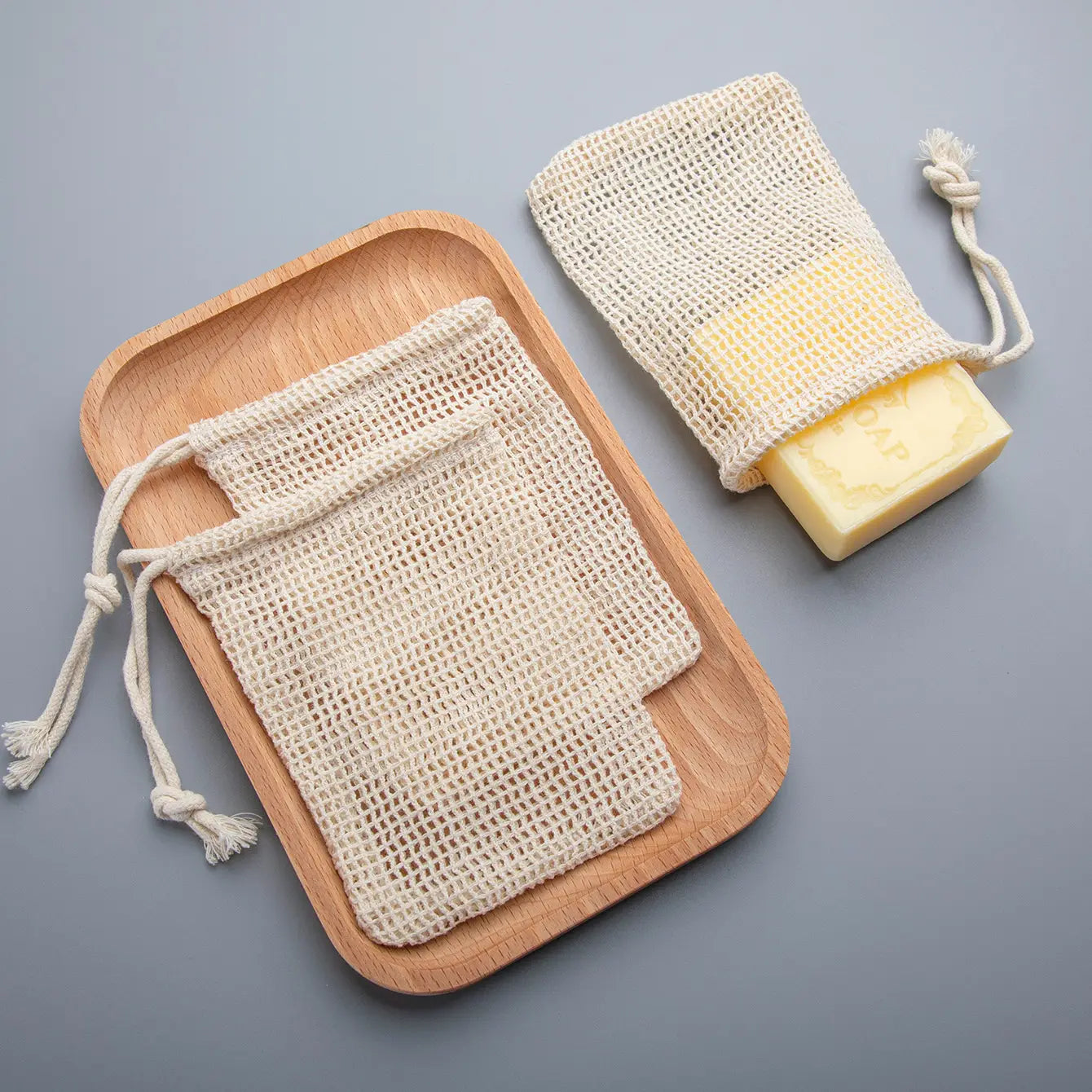beige mesh cotton soap saver bag with drawstring closure from a cotton soap saver 3 pack for convenient storage and use