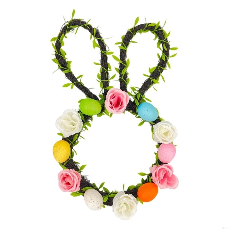 Easter bunny floral wreath for front door made of dark green vine decorated with artificial pink white and yellow roses and colorful plastic eggs.