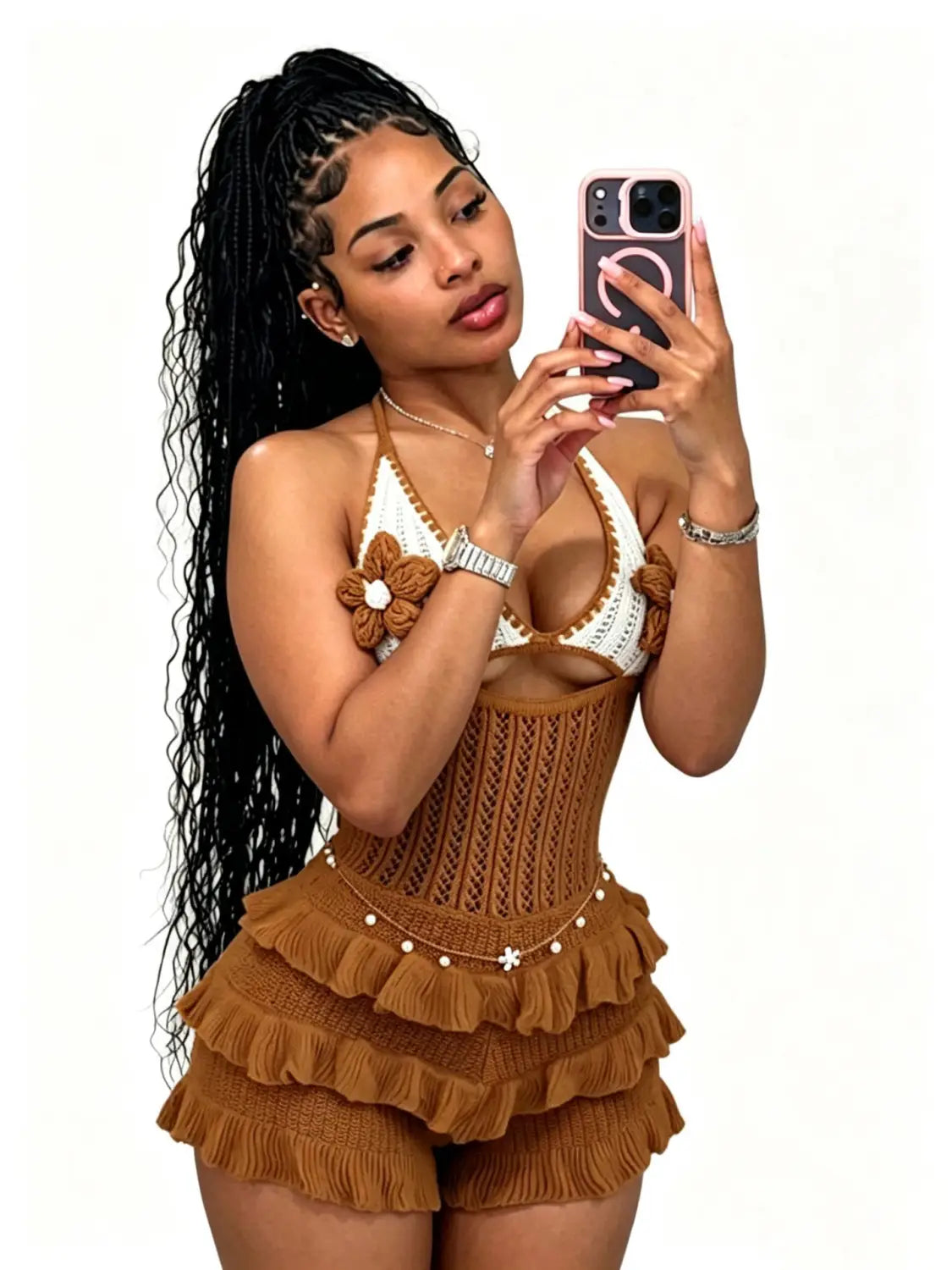 brown knitted corset-style romper with ruffled shorts paired with a white crochet top featuring a flower accent in a knitted ruffle halter romper summer playsuit.