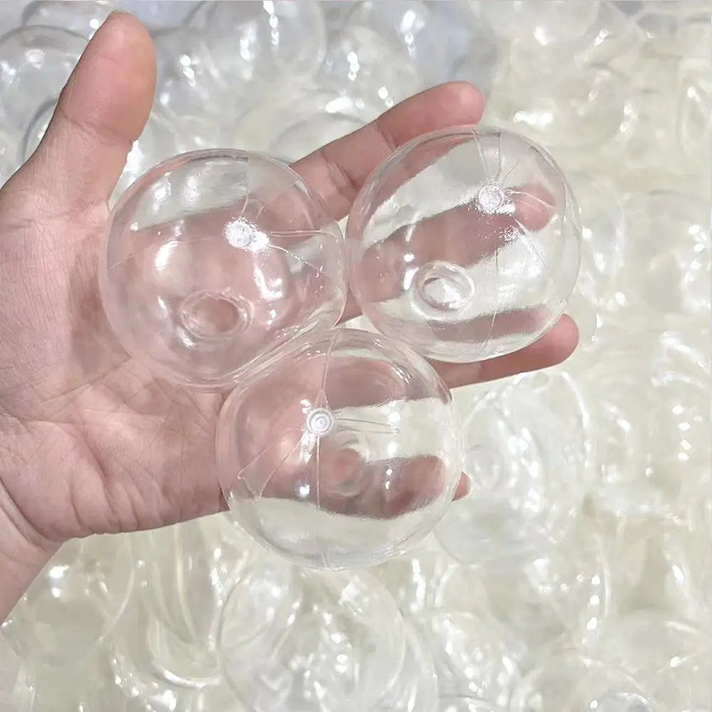 Des balles de plage gonflables en plastique transparent, faites main, utilisées comme jouets antistress en forme de balle molle sensorielle.
