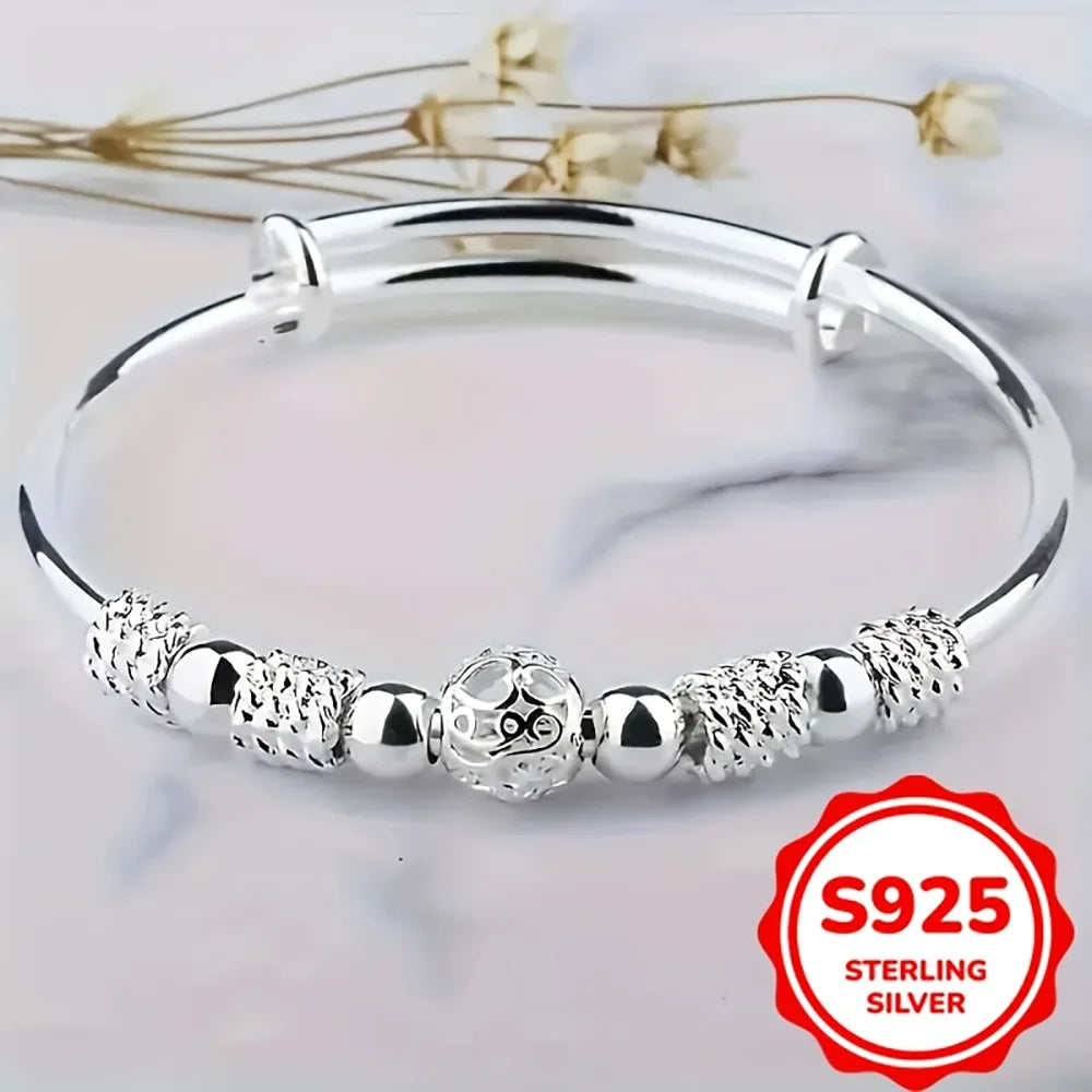 Sterling silver beaded bangle bracelet for women featuring an exquisite engraved owl charm and alternating textured and smooth spherical beads, ideal as a party gift.