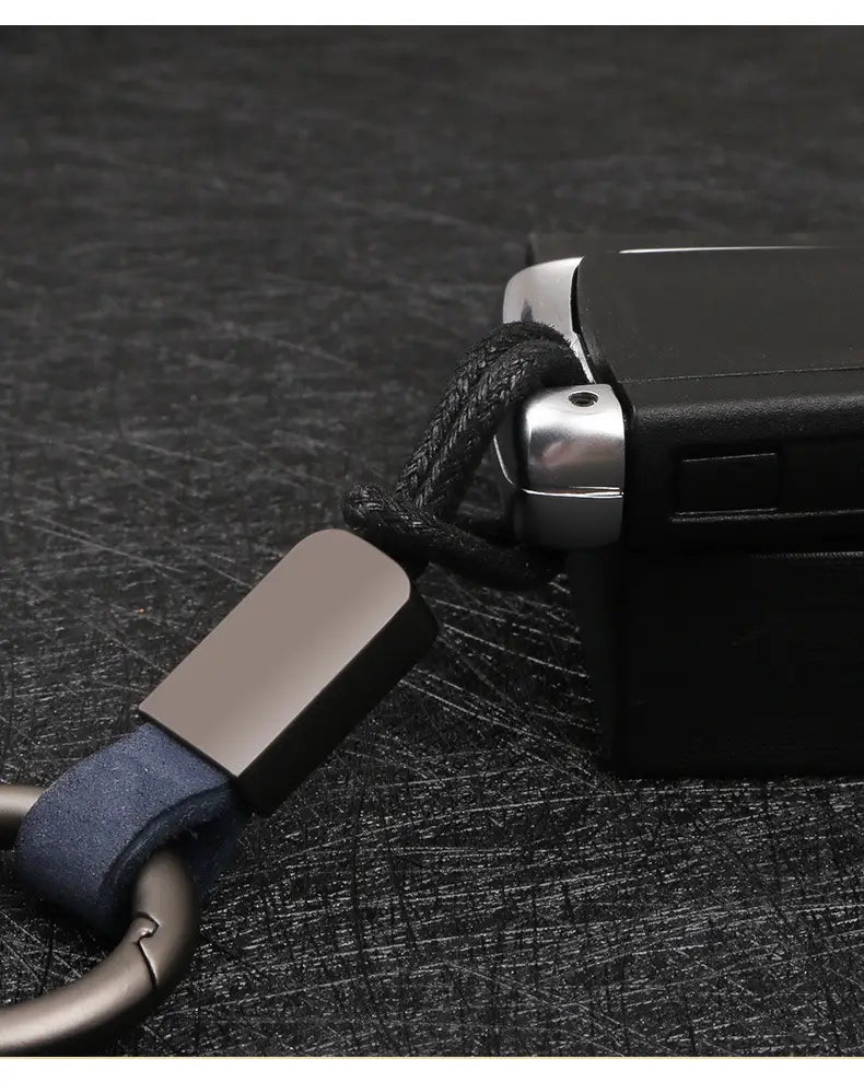 Leather keychain lanyard metal ring car key holder featuring a black keychain with a matte-finished metal clasp and dark blue leather strap.