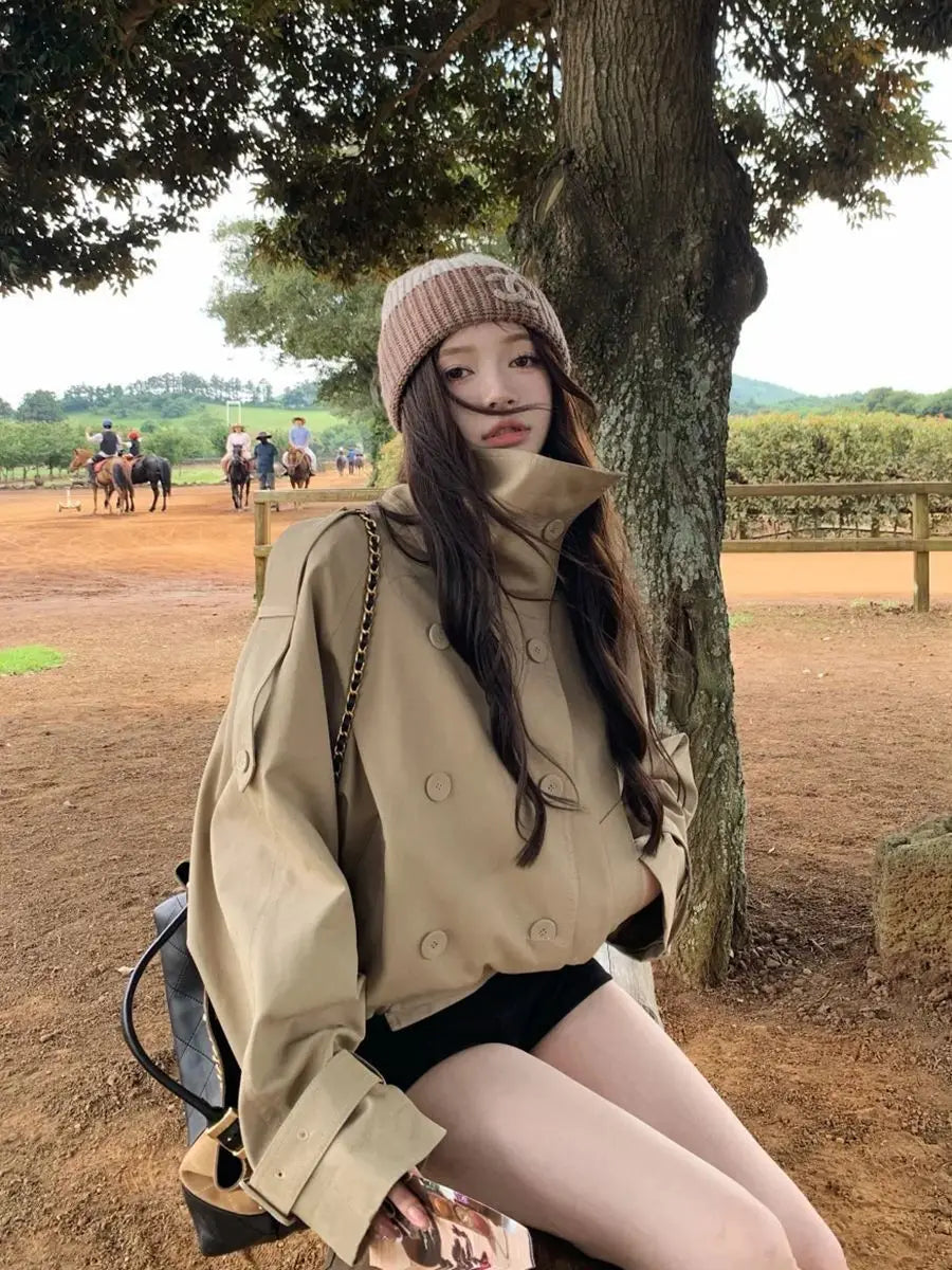 Women Korean trench coat beige utility jacket featuring a beige trench coat with double-breasted buttons and wide cuffs.
