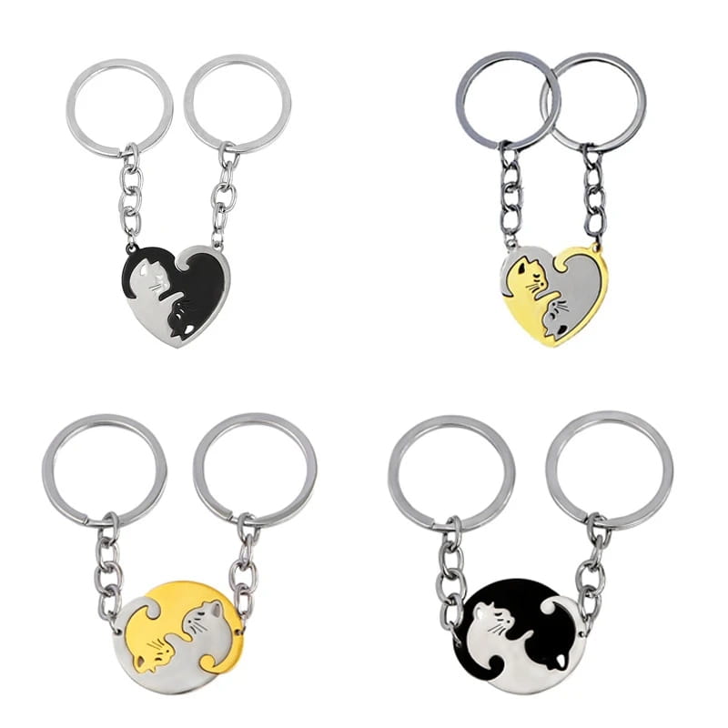 set of four interlocking cat couple keychains featuring matching heart and circular designs with two cats in black and white or yellow and silver metallic finishes.