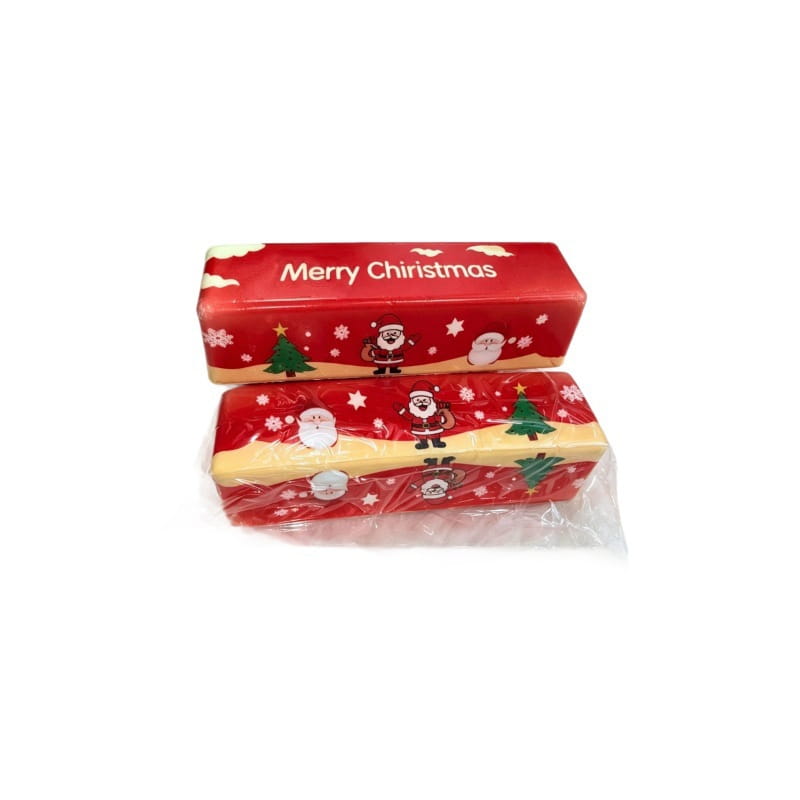Jouet antistress tout doux de type barre de beurre à relâchement lent de Noël en emballage en boîte de mouchoirs rouge et jaune, avec des flocons de neige et des sapins représentant le Père Noël.