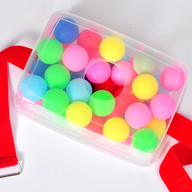A clear plastic container filled with colorful round foam balls in shades of pink green yellow blue and red for the Shaking Swing Balls Party Game Set.