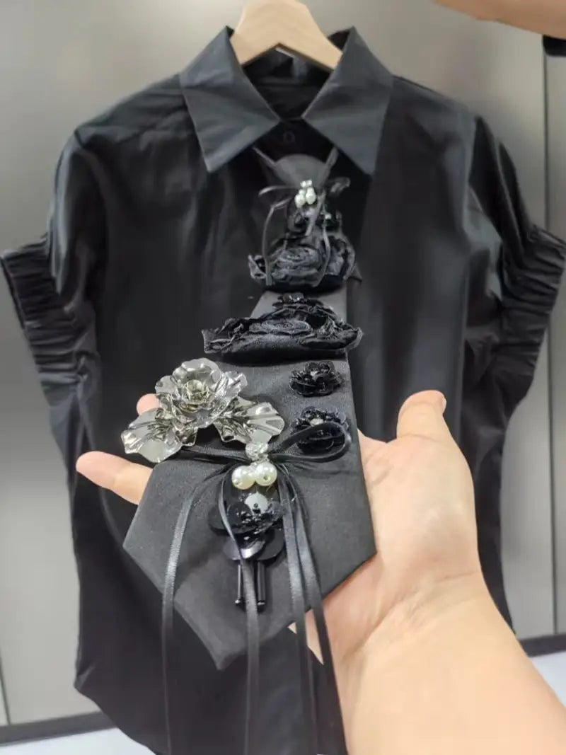 short sleeve shirts blouses for women featuring a black tie adorned with intricate floral embellishments including crystal roses and pearl accents