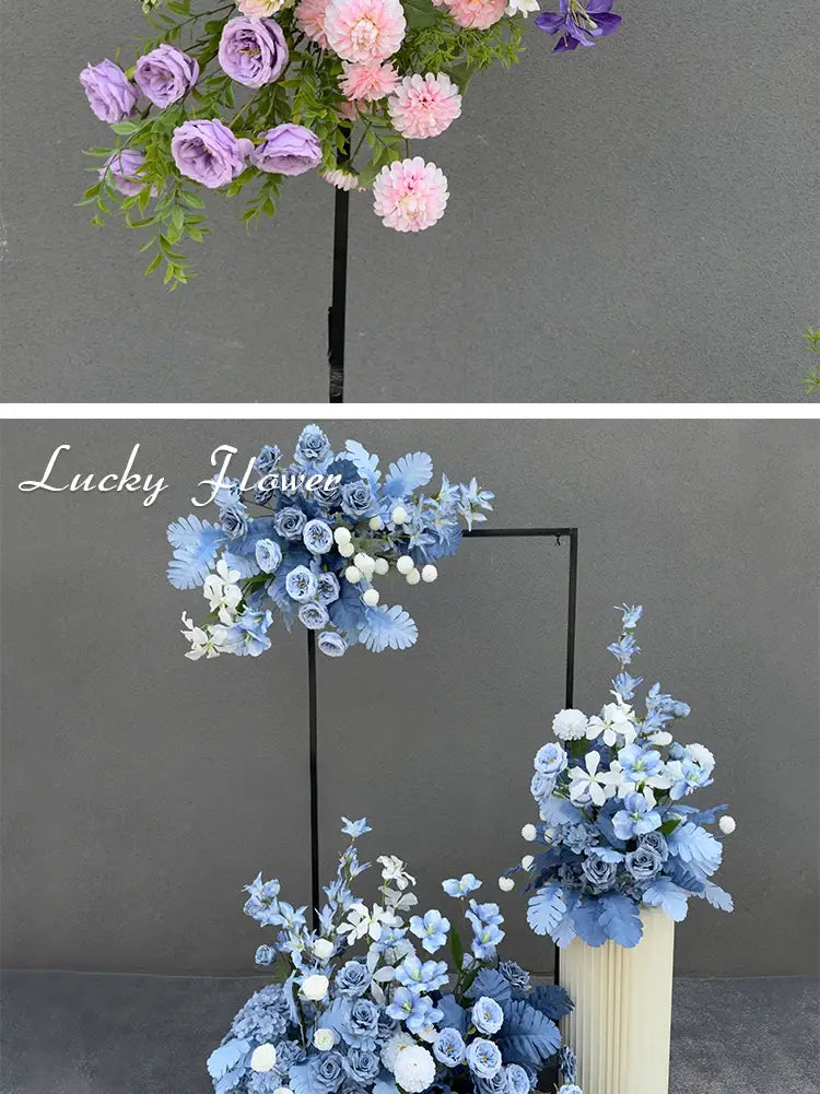 A delicate arrangement of artificial flowers in soft lavender pink and blue hues with green foliage forming a wedding arch floral backdrop row.