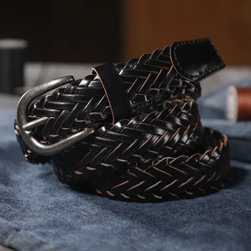 Black woven leather belt with a silver-toned buckle unisex casual accessory.