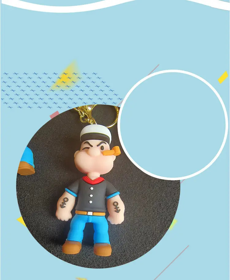 A popeye silicone keychain cartoon doll bag pendant featuring a figurine with a white sailor hat black shirt and blue pants.