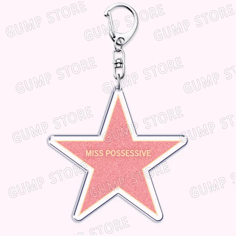 Pink glitter star-shaped acrylic keychain with silver metallic outline and clasp for Tate Mcrae music fan gift