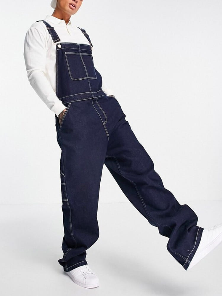 Men denim overalls in dark blue denim with contrasting white stitching and a classic relaxed fit for casual use