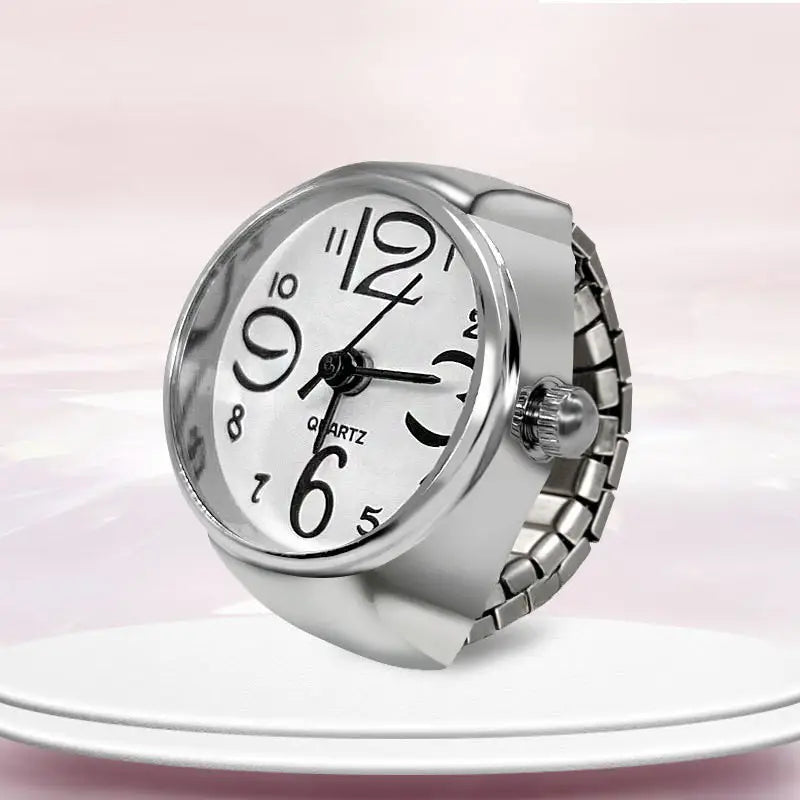 Silver-toned quartz ring watch with a white dial black arabic numerals and a flexible metal band for finger couple jewelry.