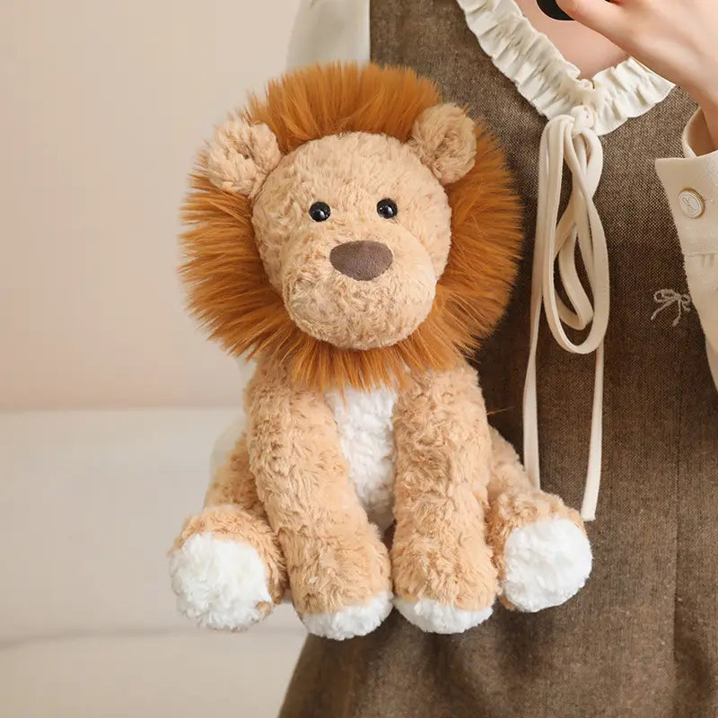 A plush stuffed animal toy 25cm featuring a tan and white lion design with a fluffy orange mane.
