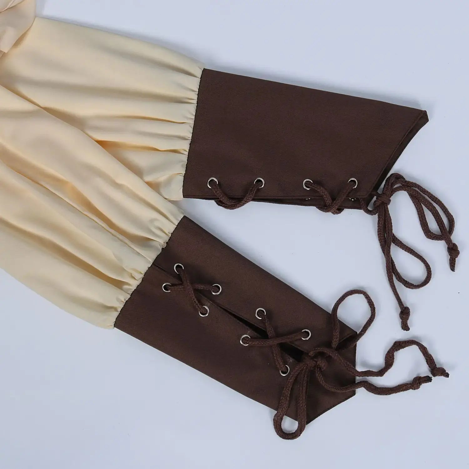 brown lace-up arm guards with cream-colored fabric cuffs displayed in front view for mens pirate medieval renaissance arba global shirt ensemble