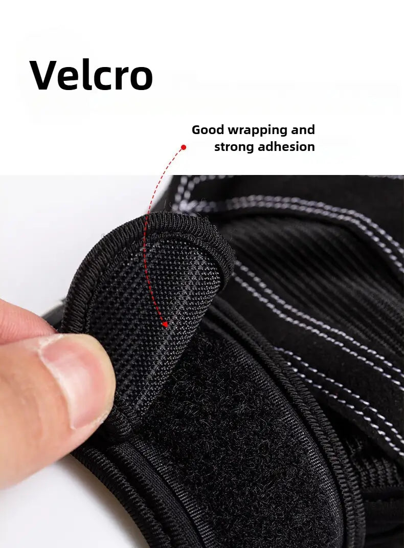 Black velcro strap with textured fabric and white stitching on the back side of weightlifting gloves with wrist wrap.